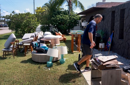 A man salvages possessions from the storm in Hudson, Florida.