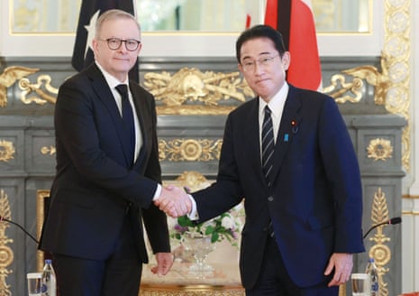Anthony Albanese shakes hands with Japan's Fumio Kishida during their meeting in Tokyo