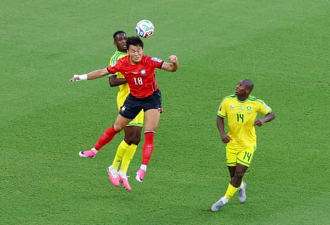 South Korea's Oh Hyeon-gyu goes up for a header with South Africa's Mbekezeli Mbokazi.