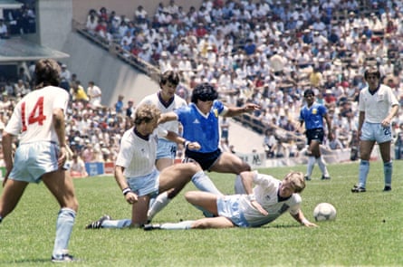 Diego Maradona dribbles past three English defenders on 22 June 1986 in Mexico City during the World Cup quarter-final between Argentina and England