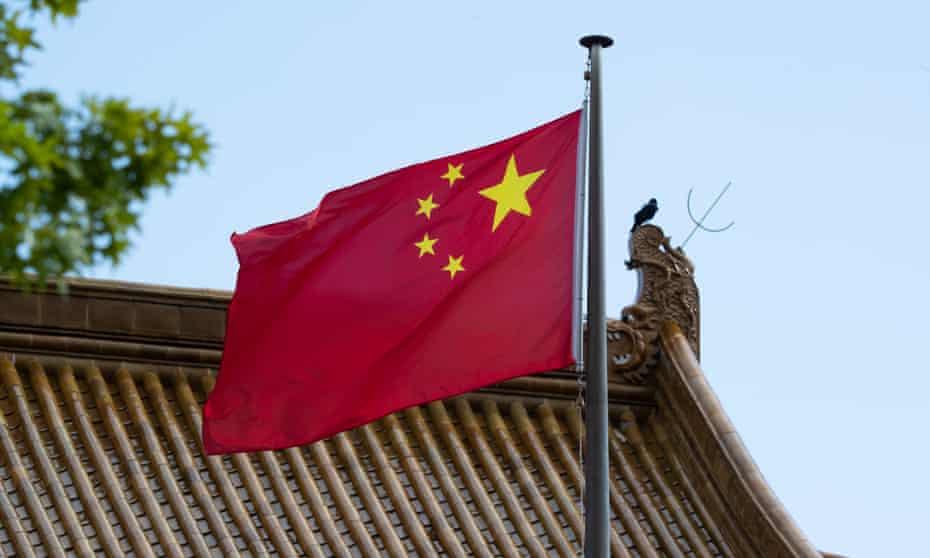 The Chinese flag flies at the Chinese Embassy in Canberra