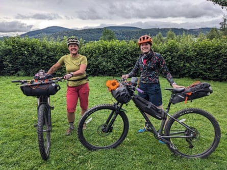 Ailsa and Emily standing with their loaded bikes