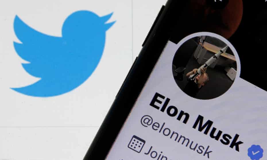 twitter logo next to phone showing Musk's twitter profile