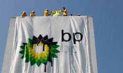 Greenpeace activists place a banner in a protest against the BP oil spill in the Gulf of Mexico at the Austrian BP headquarters in Wiener Neustadt<br>Greenpeace activists place a banner with the British Petroleum (BP) Logo in a protest against the BP oil spill in the Gulf of Mexico at the Austrian BP headquarters in Wiener Neustadt July 22, 2010. Banner reads "BP out of the deep sea".