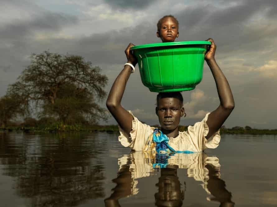 Nyanyang Tong, 39, on her way to the Action Against Hunger centre with her one-year-old son, Mamuch Gatkuoth, in Paguir.