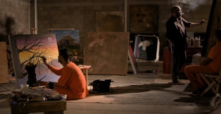 César and one of his students painting inside Puente Grande prison in Mexico