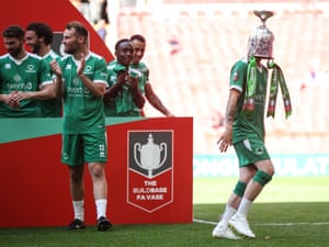 Sport (away from the action), winner - Goal scorer Kieran Barnes, of Newport Pagnell Town, wearing the FA Vase trophy on his head after they beat Littlehampton Town 3-0 during the final at Wembley Stadium on 22 May 2022