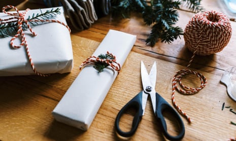 Wrapped Christmas presents with string and scissors