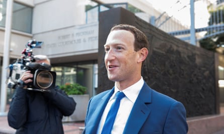 Zuckerberg smiles in suit outside court