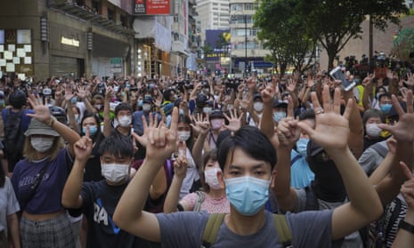 protesters against the new national security law gesture with five fingers, signifying the “Five demands - not one less” on the anniversary of Hong Kong’s handover to China