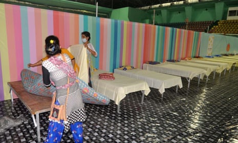 Workers prepare beds at a Covid care centre in Guwahati, India