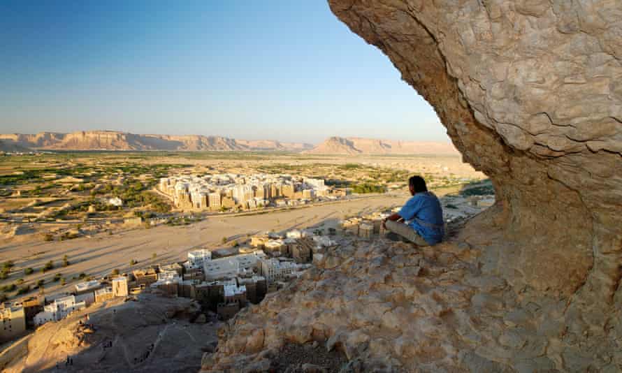 Man looks over Shibam, a Unesco World Heritage site in Yemen