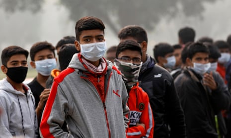 People wear masks in Delhi to combat high pollution  levels