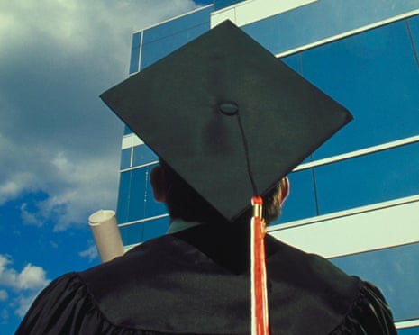 A university graduate wearing a mortarboard hat looks up at a glass-ceilinged office