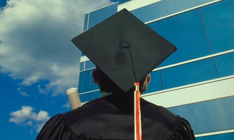 A university graduate wearing a mortarboard hat looks up at a glass-ceilinged office