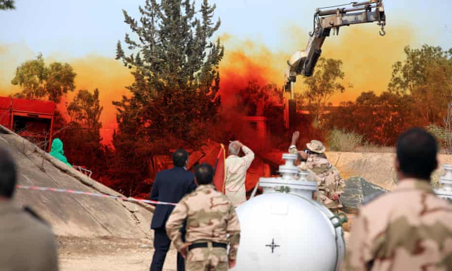 Experts in Tripoli monitor a November 2012 operation to dispose of Libyan chemical weapons.