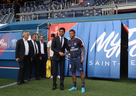 Neymar poses with president Nasser Al-Khelaifi during his presentation to the press at Parc des Princes in 2017.