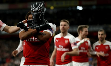 Arsenal’s Pierre-Emerick Aubameyang celebrates scoring their third goal wearing a Black Panther mask.