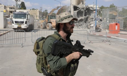 An Israeli soldier patrols near the police station in Sderot.