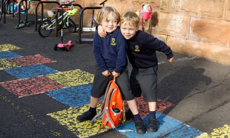 Two children outside a school Two children outside a school