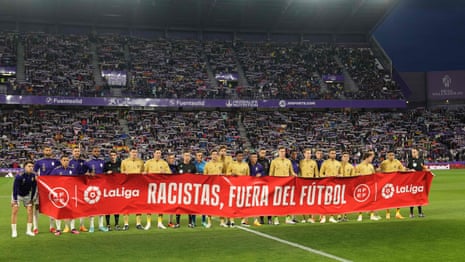 La Liga teams hold 'racists out of football' banner in support of Vinícius Júnior – video