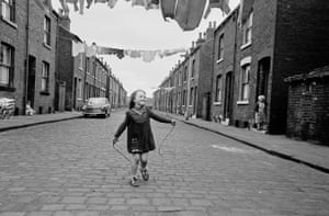 Leeds, 1970. A girl skipping in a street of back to backs