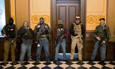 A militia group stands in front of the governors office.