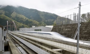 A magnetically levitating train operated by Central Japan Railway Co. making a test run is seen on an experimental track in Tsuru, Yamanashi Prefecture, in this photo taken by Kyodo 21 April, 2015.