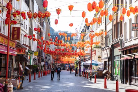 Chinese lanterns hanging above a street.