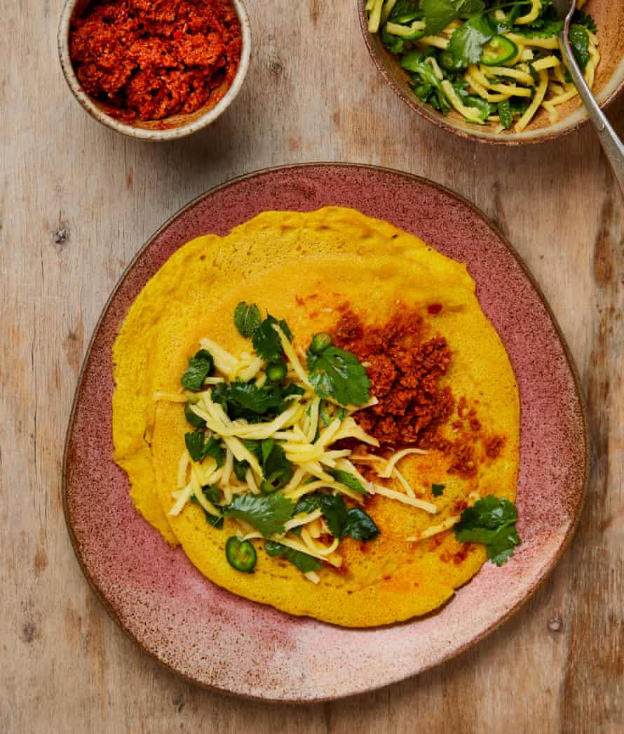 Yotam Ottolenghi’s spiced lentil pancakes with mango salsa and coconut chutney.