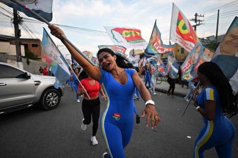 A Lula supporter leads the celebrations during a campaign rally in Belford Roxo, Rio de Janeiro State.