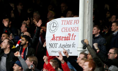Arsenal fans display a banner saying "Arsenal FC not Arsène FC"
