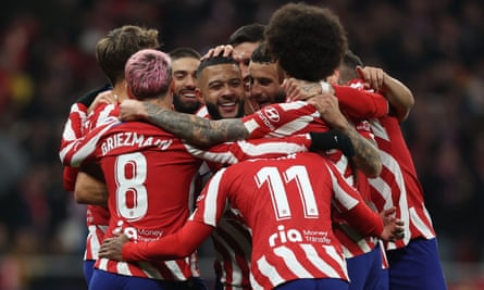 Memphis Depay is congratulated by his teammates after scoring the second of Atlético’s six goals