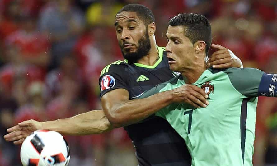 Ashley Williams tussles with Cristiano Ronaldo during Wales’s semi-final defeat to Portugal in Lyon