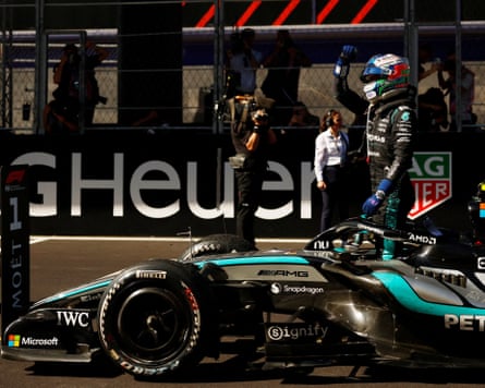 Kimi Antonelli gets out of his car and waves to the crowd