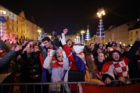 Croatia fans in Zagreb’s Ban Josip Jelacic Square celebrate after the match as they finish in third place.