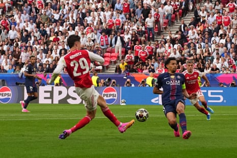 Arsenal's Kai Havertz’s shot is blocked by PSG's Marquinhos.