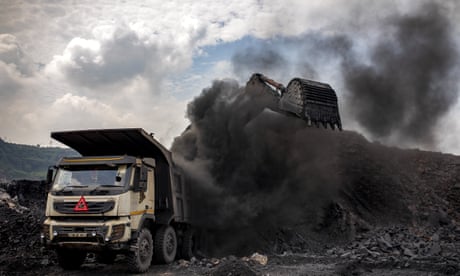 Coal being loaded into a truck at an open-cast mine near Dhanbad, India