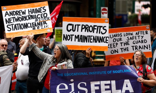 A picket line outside Glasgow Central station during a nationwide strike called by the RMT union, 27 July 2022
