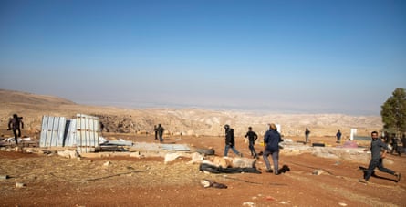 Residents of Mughayer a-Deir flee the village.