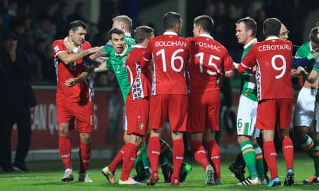 Tempers flare between the Republic of Ireland and Moldova players.
