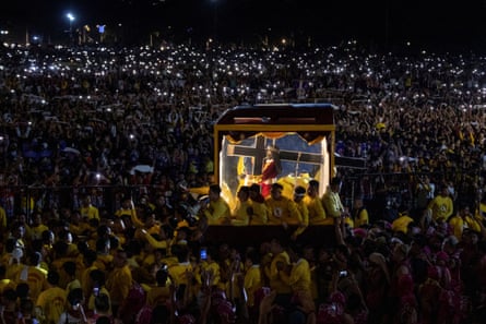 Filipino Catholic devotees surround the carriage carrying the statue of the Black Nazarene as its annual procession begins on its feast day in Manila, Philippines, 9 January