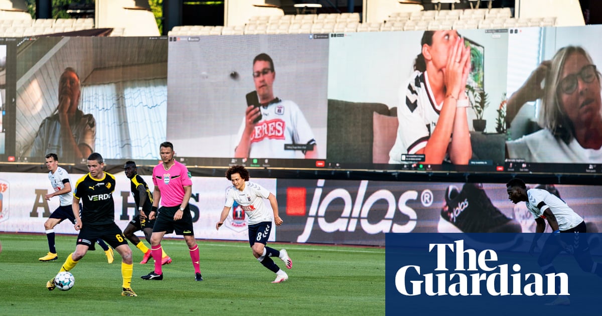 Football fans take usual places via Zoom as matches restart in Denmark – video