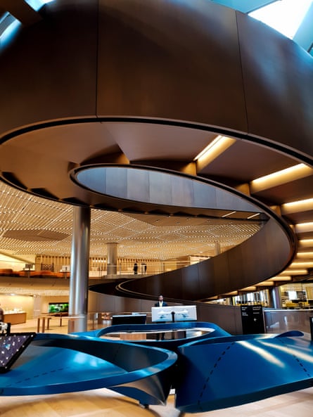 Interior Bloomberg HQ. A great bronze ramp coils through the floors.