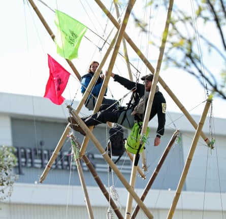 Handle with care … Extinction Rebellion protesters on a tensegrity tower in Broxbourne.