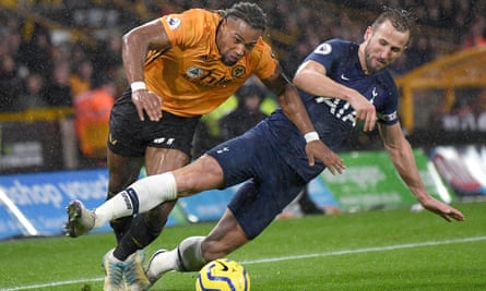 Wolves goal-scorer Adama Traore battles for possession with Spurs striker Harry Kane.