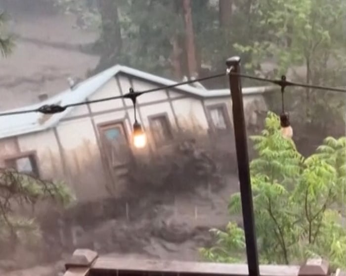 Moment house is swept away in New Mexico flash flooding – video