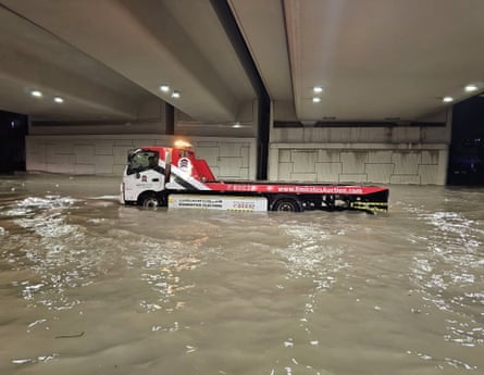 A submerged duty machine is seen after heavy rain in the United Arab Emirates