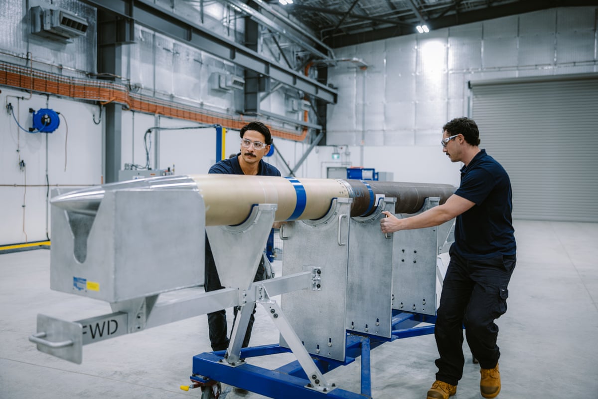 Workers with a missile at the Port Wakefield facility