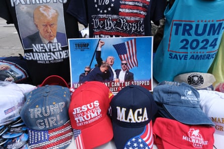 Pro-Trump hats, T-shirts and photos on a table.